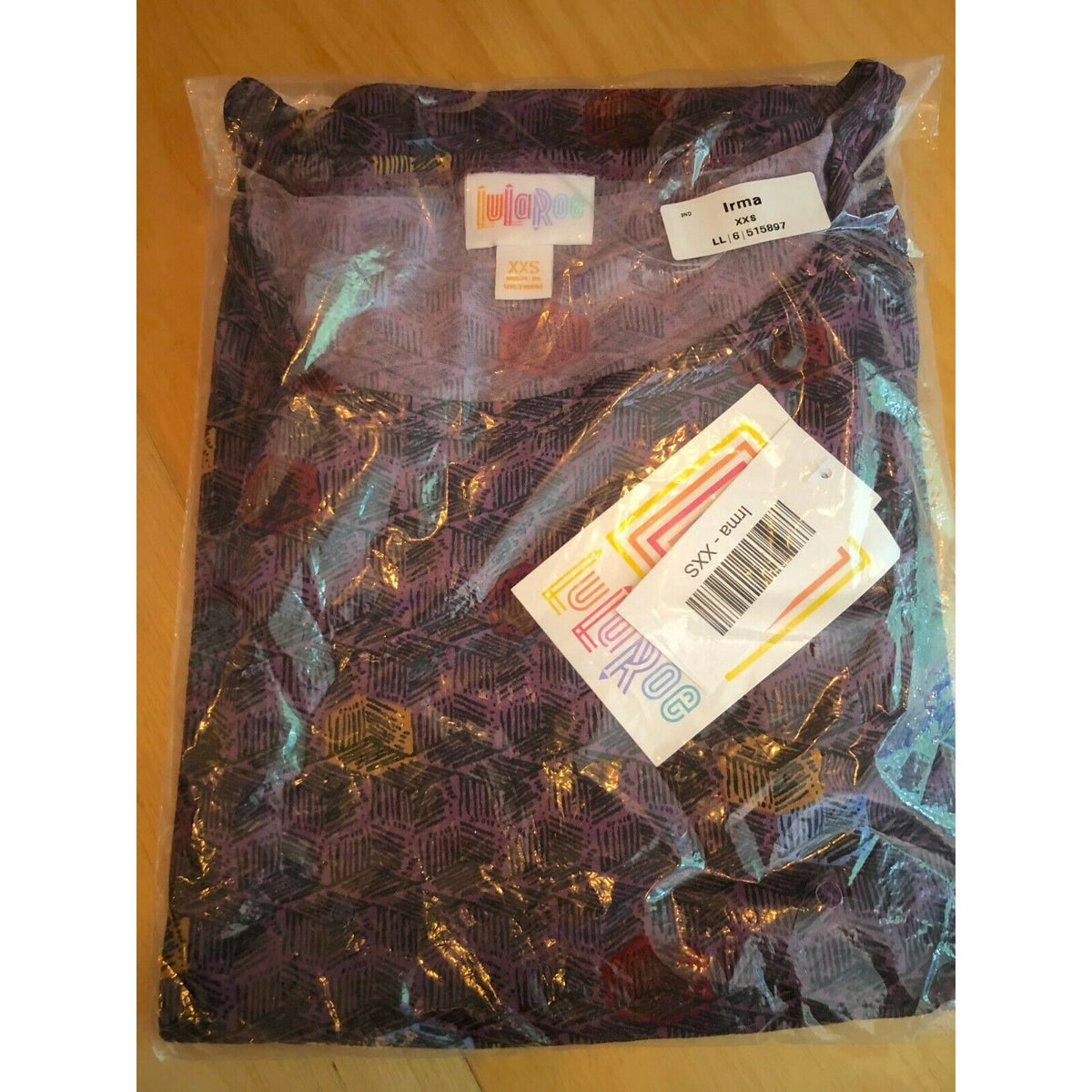 LuLaRoe Irma XXS Purple Geometric Print Short Sleeve Tunic Top Hi Low Hem