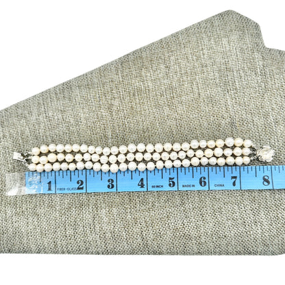 Vintage Triple Strand Faux Pearl Bracelet With Silver Flower Clasp 8 Inches Long