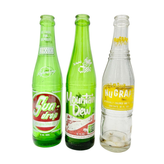 Set of 3 Vintage Empty Soda Pop Bottles 10 FL OZ NuGrape Mountain Dew Sun Drop